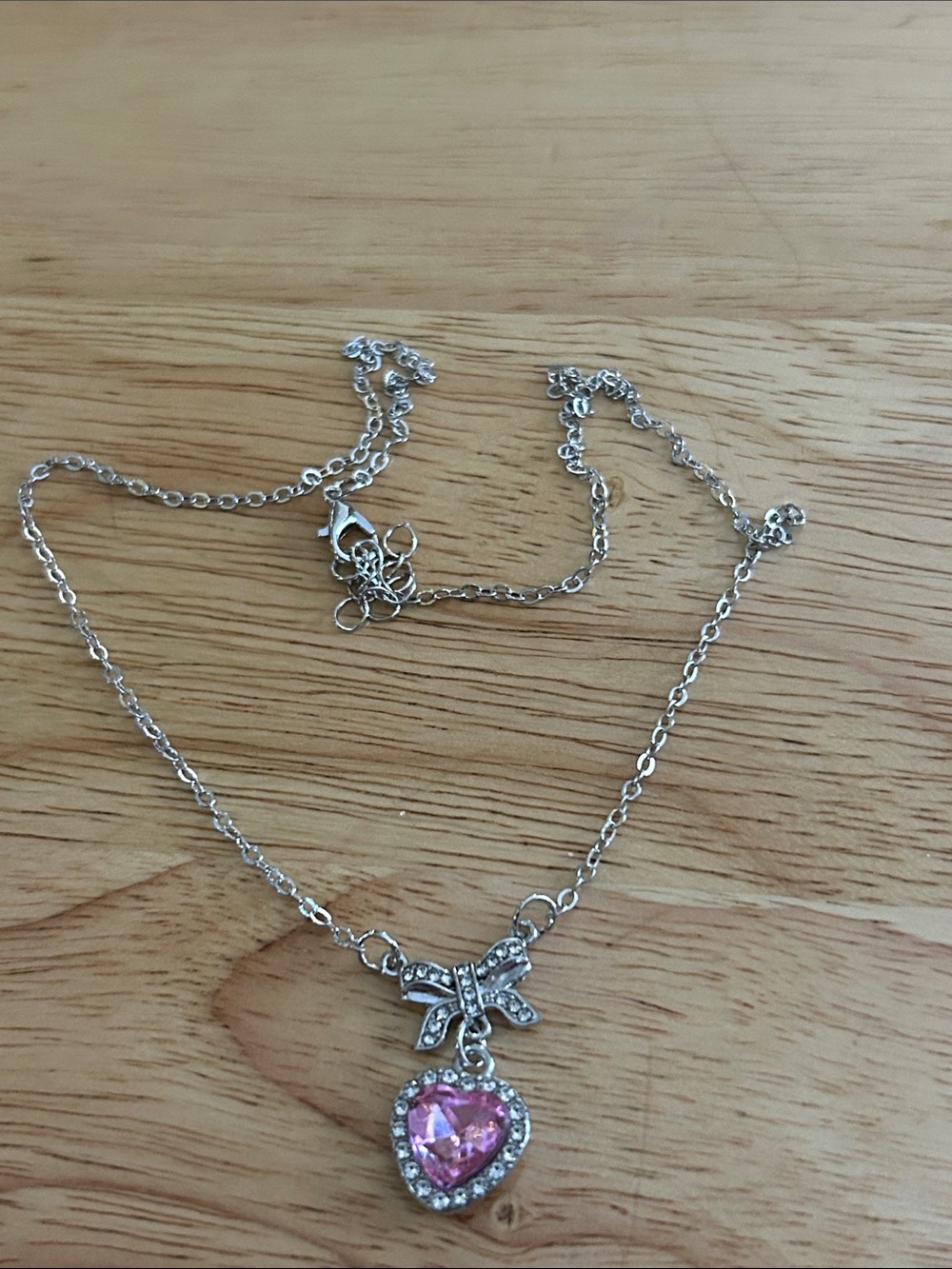 Silver-tone Necklace with Pink Heart Pendant and Bow Accent